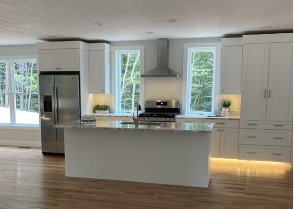 21 Paddock Road Rutland, MA 01543 - Photo 14 of 18 a kitchen with stainless steel appliances a sink a stove and a window
