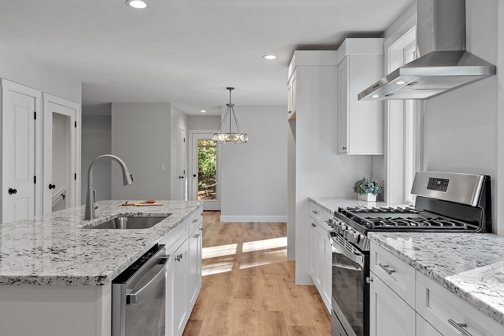 21 Paddock Road Rutland, MA 01543 - Photo 7 of 18 a kitchen with stainless steel appliances granite countertop a sink stove and refrigerator