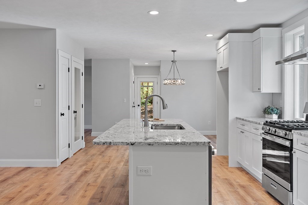 21 Paddock Road Rutland, MA 01543 - Photo 8 of 18 a kitchen with stainless steel appliances granite countertop a sink stove and refrigerator