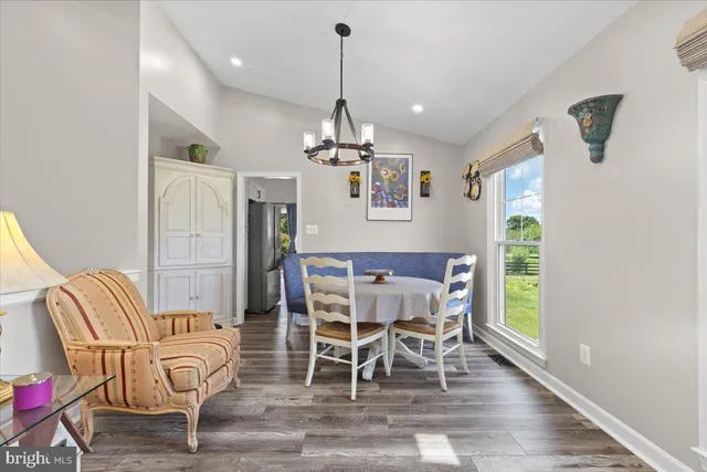 a view of a dining room with furniture window and wooden floor