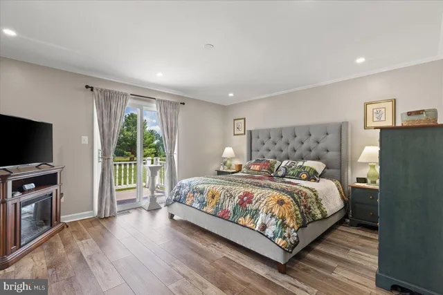 a bedroom with a bed and a television