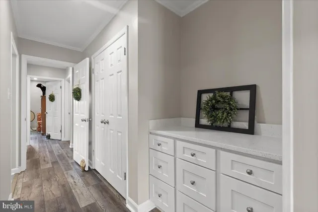 a view of hallway with wooden floor