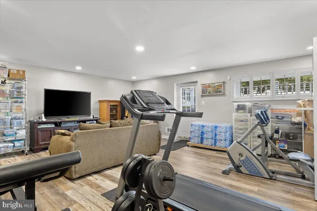 a view of a livingroom with furniture and a flat screen tv