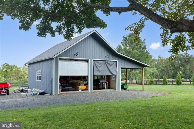 a view of a house with a yard and garage