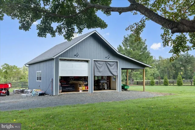 a view of a house with a yard and garage