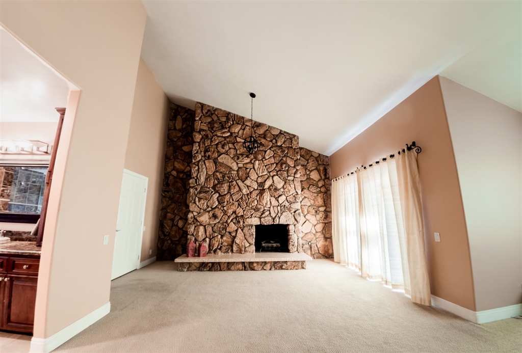 16716 Valle Verde Road Poway, CA 92064 - Photo 13 of 25 Master bedroom retreat with vaulted ceilings and stone fireplace