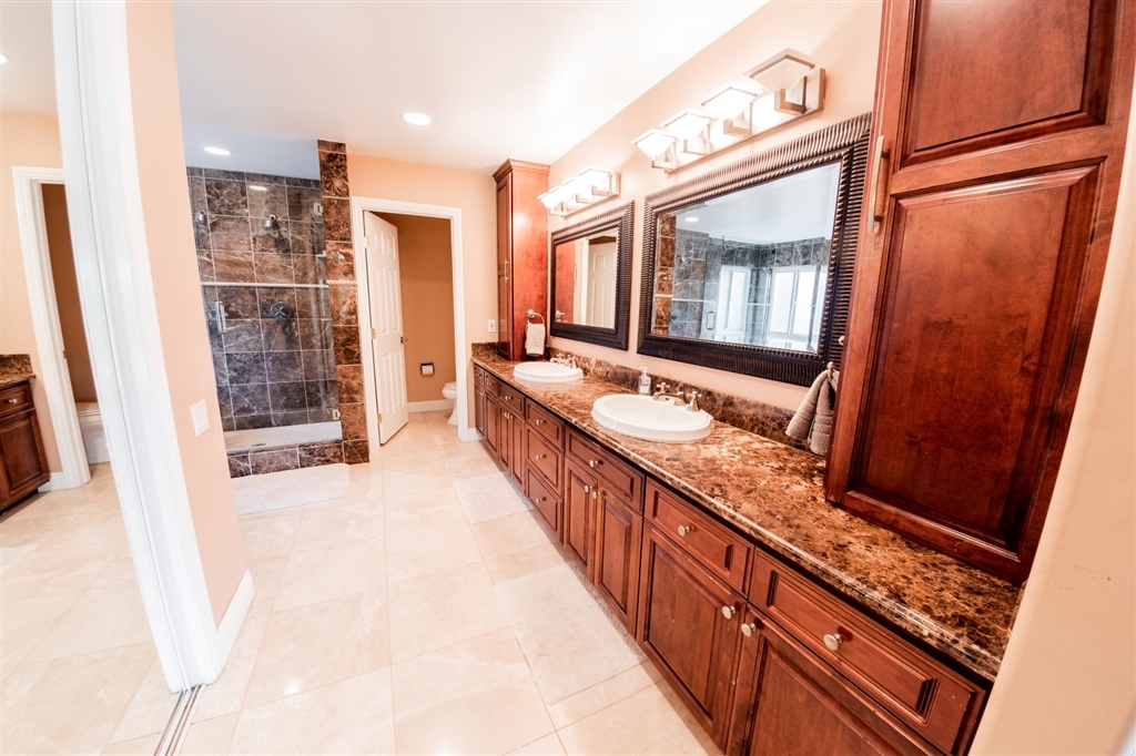 16716 Valle Verde Road Poway, CA 92064 - Photo 14 of 25 Separate tub and walk-in shower with marble surrounds/wainscot