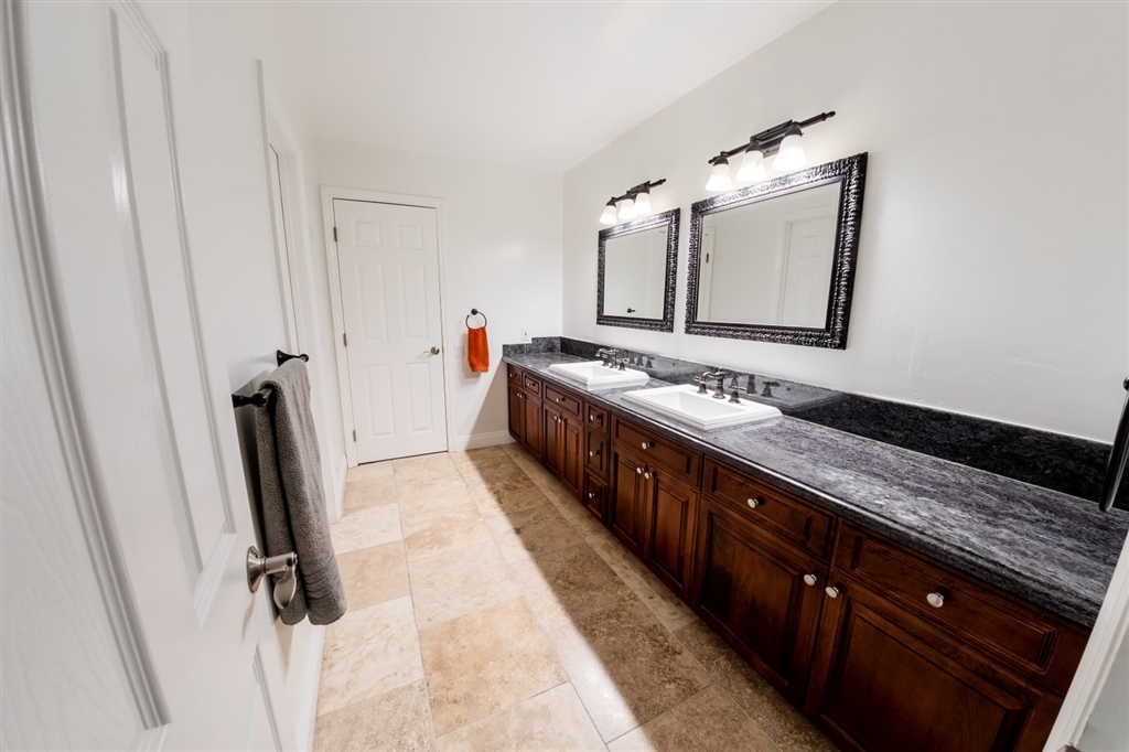 16716 Valle Verde Road Poway, CA 92064 - Photo 17 of 25 Jack and Jill bathroom with expansive double vanity/sinks and separate shower area with pedestal sink