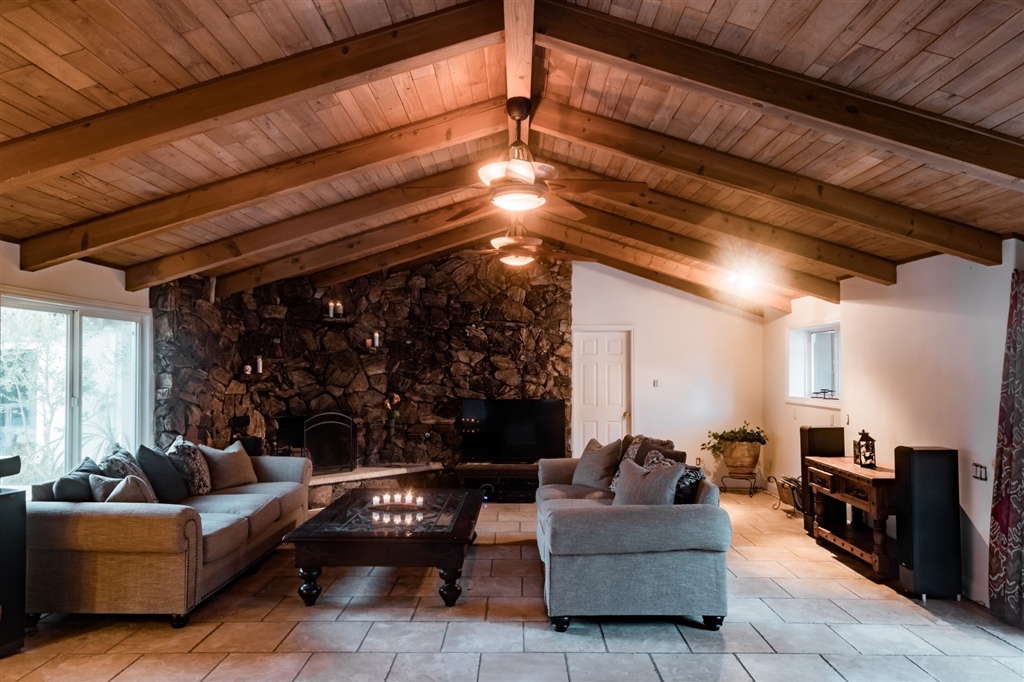 16716 Valle Verde Road Poway, CA 92064 - Photo 7 of 25 Custom wood beam ceilings with stone fireplace