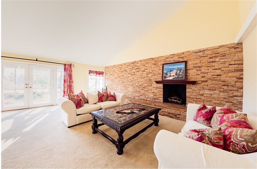 16716 Valle Verde Road Poway, CA 92064 - Photo 9 of 25 Large living room with vaulted ceilings and stone fireplace