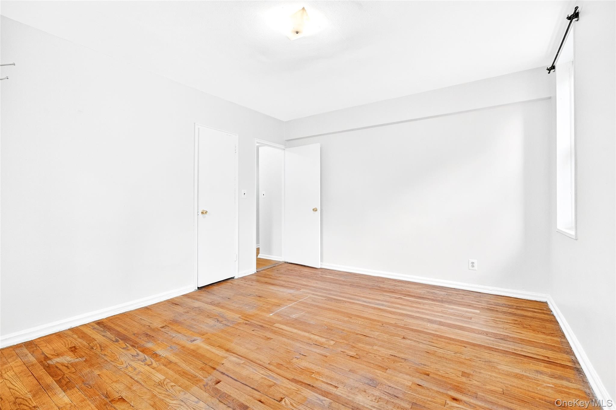 770 Bronx River Road, Unit A36 Bronxville, NY 10708 - Photo 12 of 22 a view of empty room with wooden floor