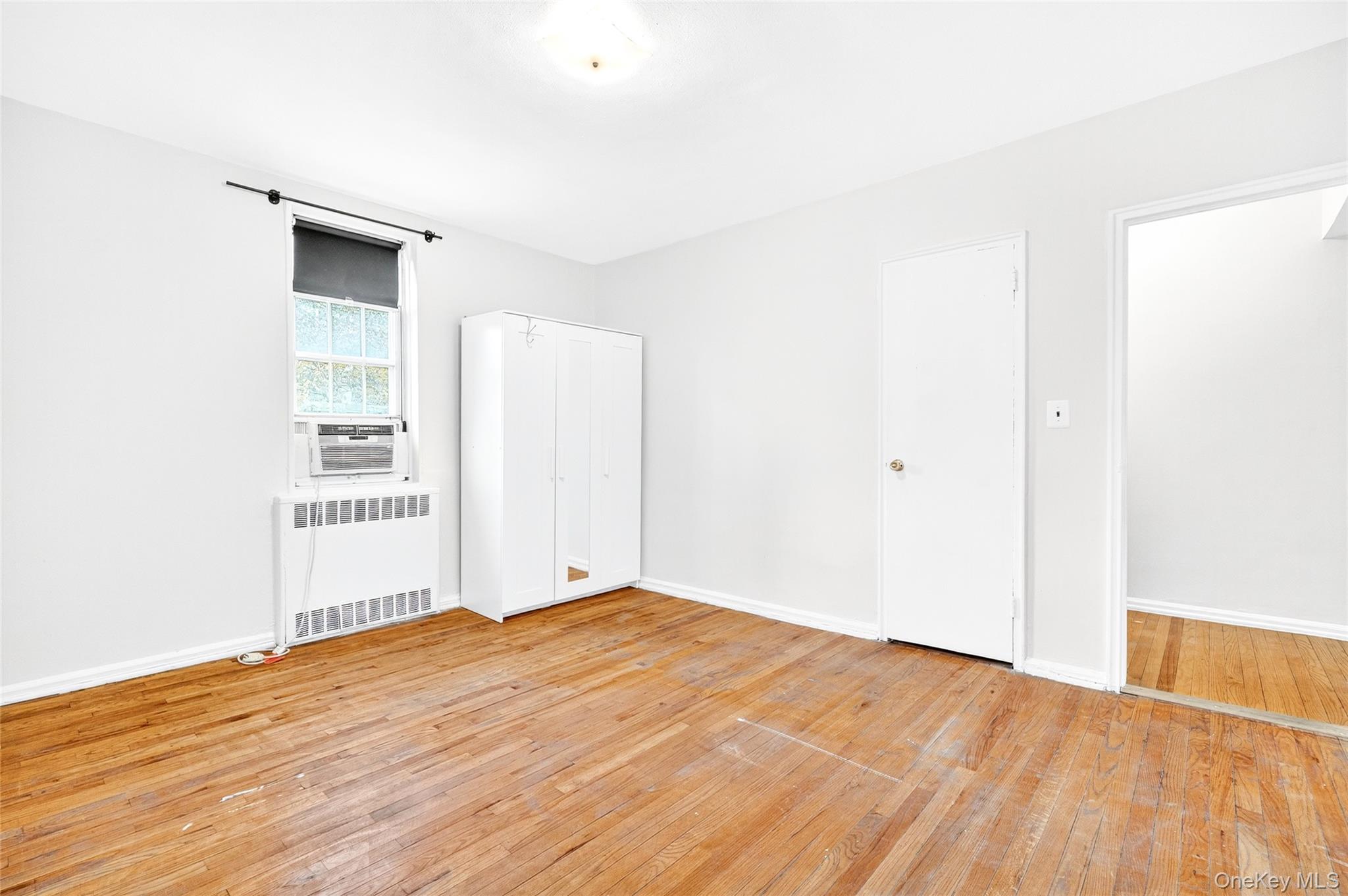 770 Bronx River Road, Unit A36 Bronxville, NY 10708 - Photo 13 of 22 a view of an empty room with wooden floor