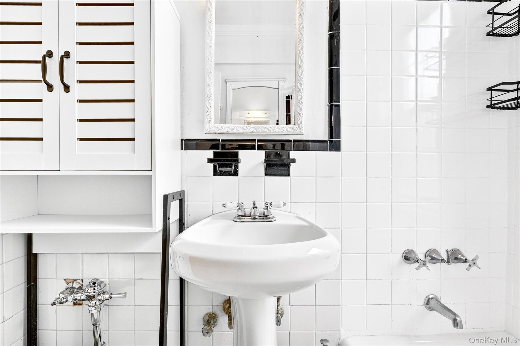 770 Bronx River Road, Unit A36 Bronxville, NY 10708 - Photo 14 of 22 a bathroom with a sink and a mirror