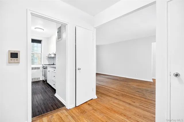 a kitchen with granite countertop a sink stainless steel appliances and cabinets