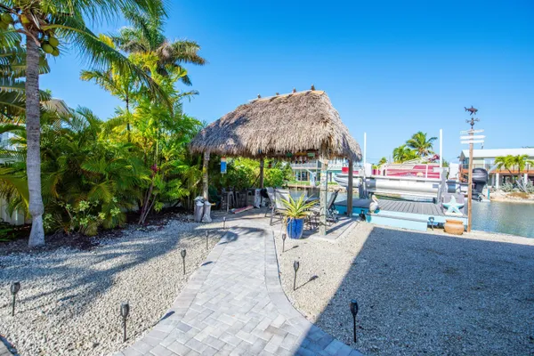 a living room with furniture a rug and a window