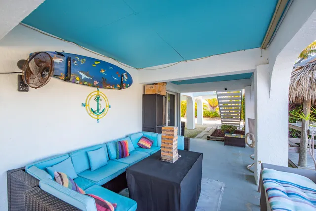 a bedroom with furniture and a large window