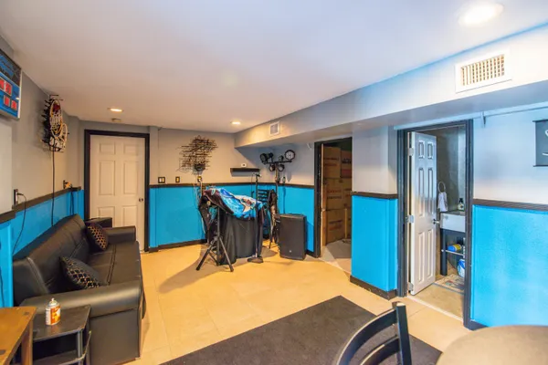 a living room with a couch and a bookshelf