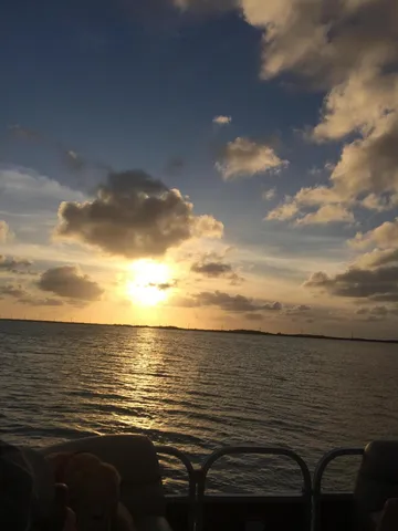 a view of a chairs and table in patio