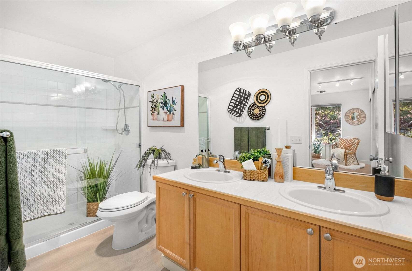 17107 123rd Place Northeast, Unit V302 Bothell, WA 98011 - Photo 11 of 20 a bathroom with a sink a mirror and a toilet