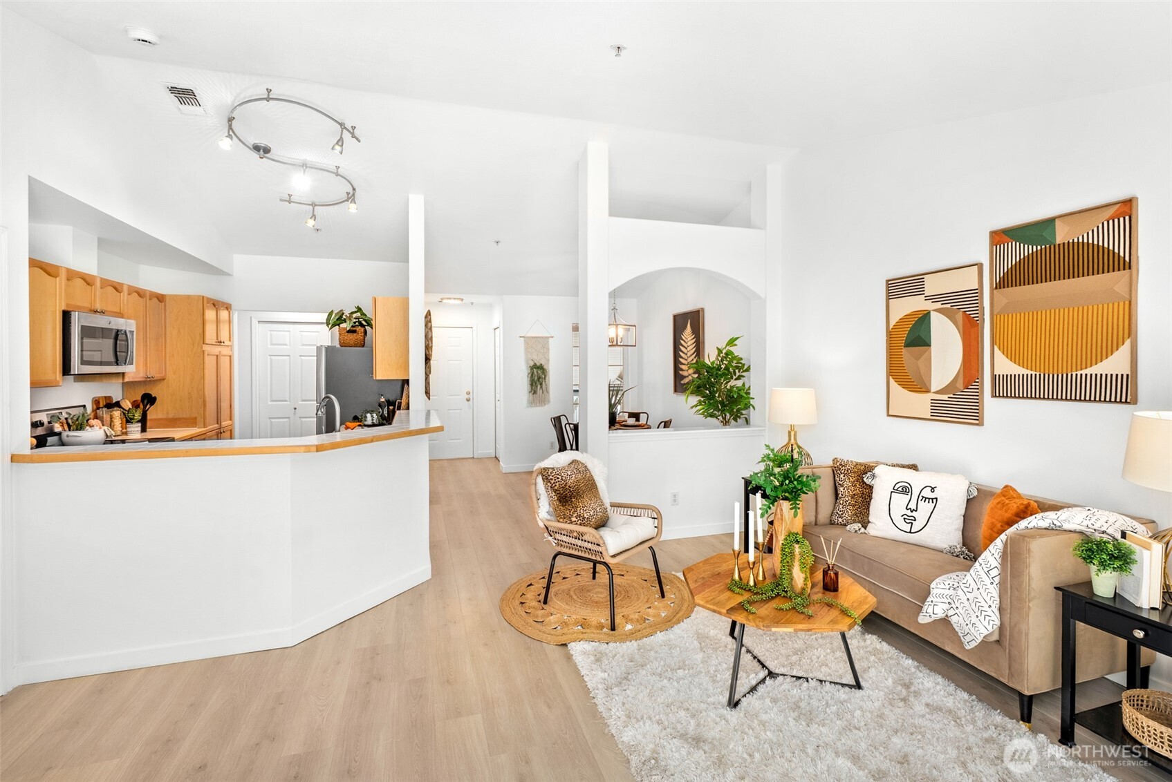 17107 123rd Place Northeast, Unit V302 Bothell, WA 98011 - Photo 7 of 20 a living room with furniture and kitchen view