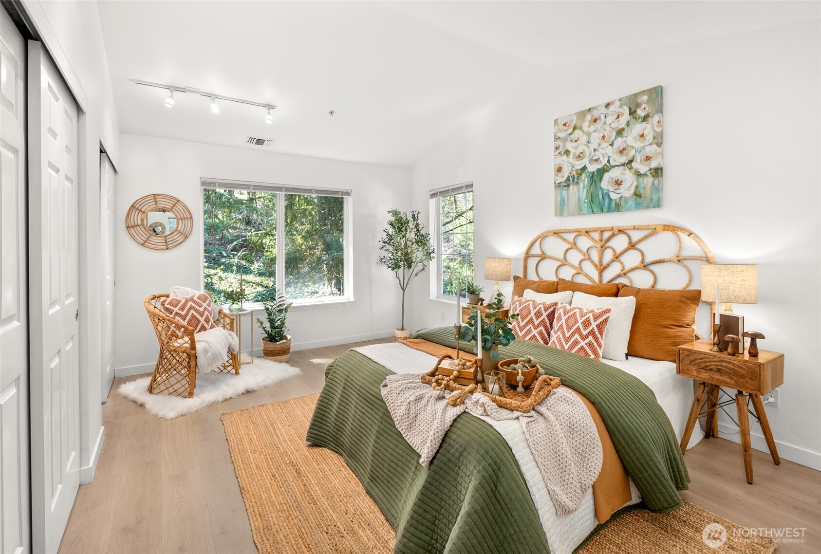 17107 123rd Place Northeast, Unit V302 Bothell, WA 98011 - Photo 10 of 20 a bedroom with a bed and a painting on the wall