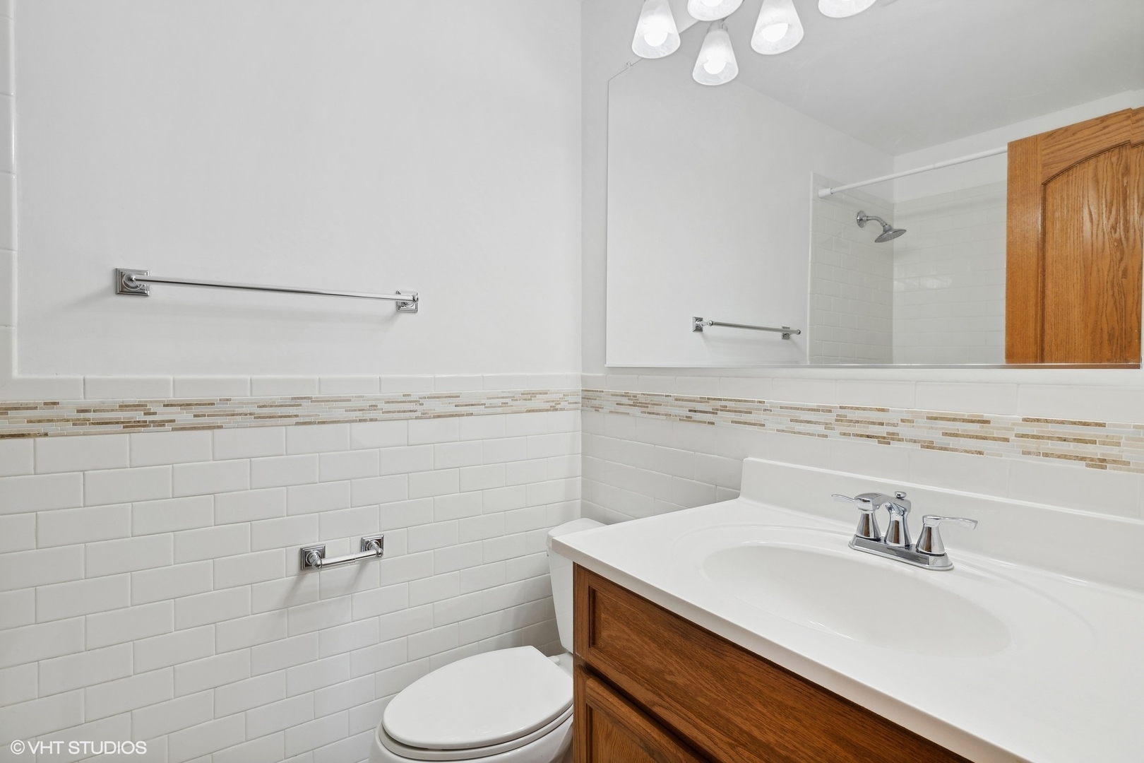 10357 Dearlove Road, Unit 1I Glenview, IL 60025 - Photo 11 of 16 a bathroom with a sink vanity mirror and toilet