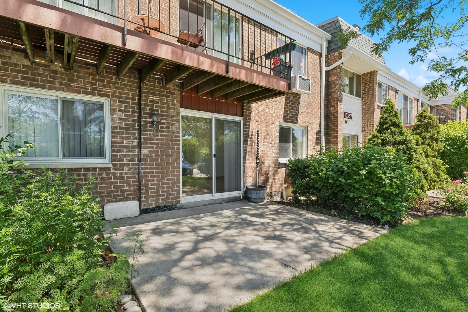 10357 Dearlove Road, Unit 1I Glenview, IL 60025 - Photo 13 of 16 a view of a house with a large window and flower plants