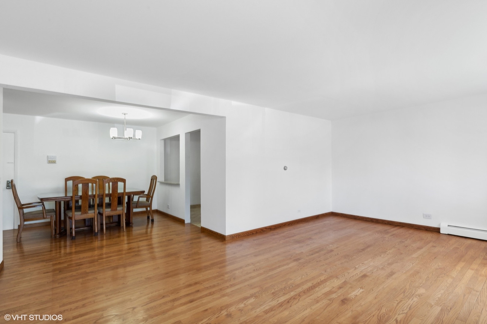 10357 Dearlove Road, Unit 1I Glenview, IL 60025 - Photo 6 of 16 a view of a dining room with furniture and wooden floor
