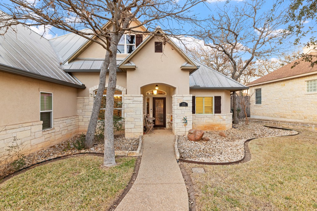 2142 Lightstone Fredericksburg, TX 78624 - Photo 8 of 30 a front view of a house with garden