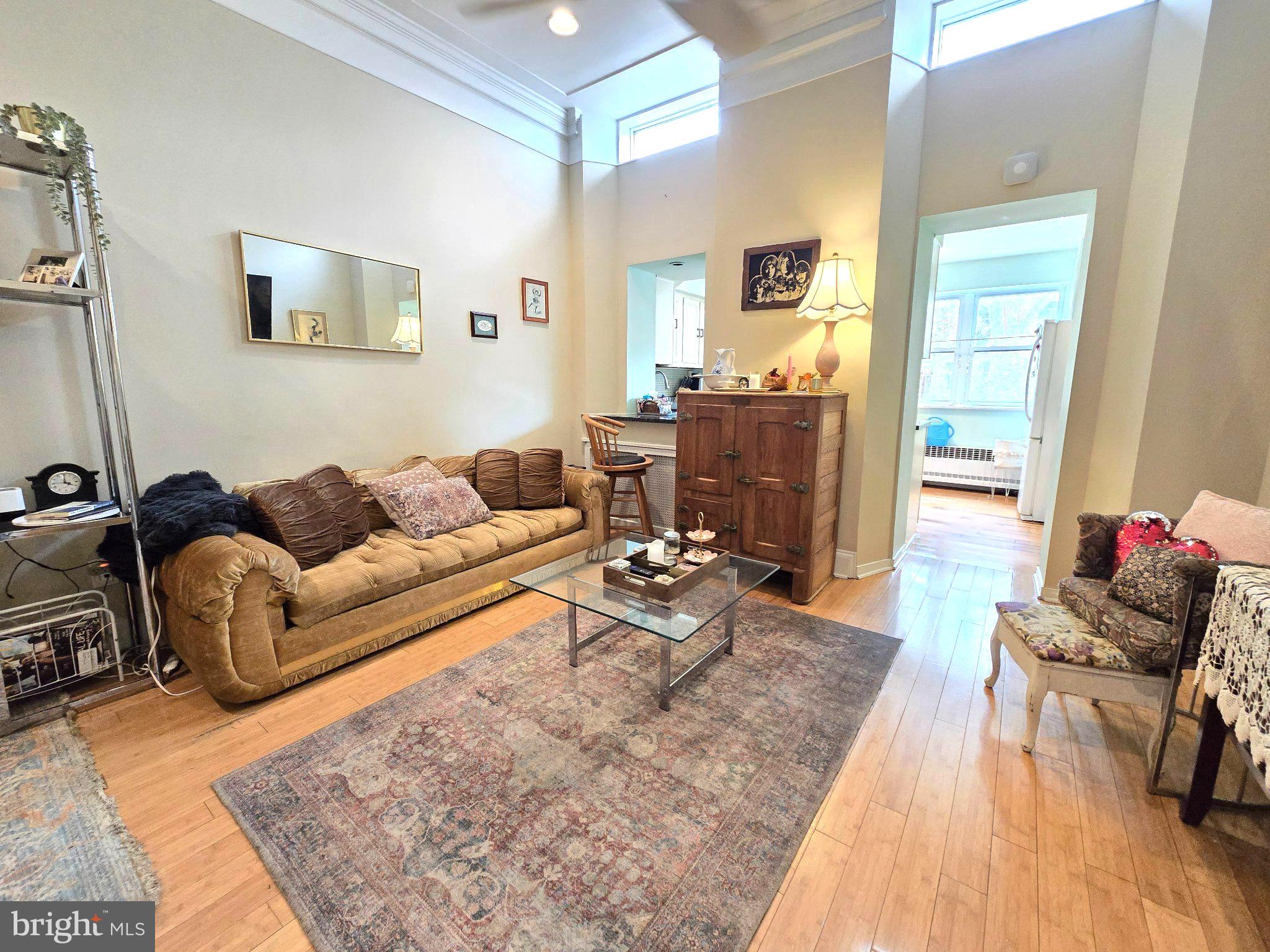 1320 South Broad Street, Unit A Philadelphia, PA 19146 - Photo 11 of 19 a living room with furniture and wooden floor