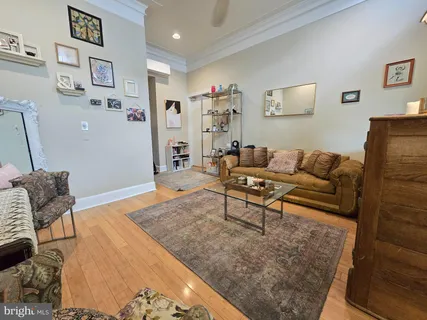 a living room with furniture and a rug