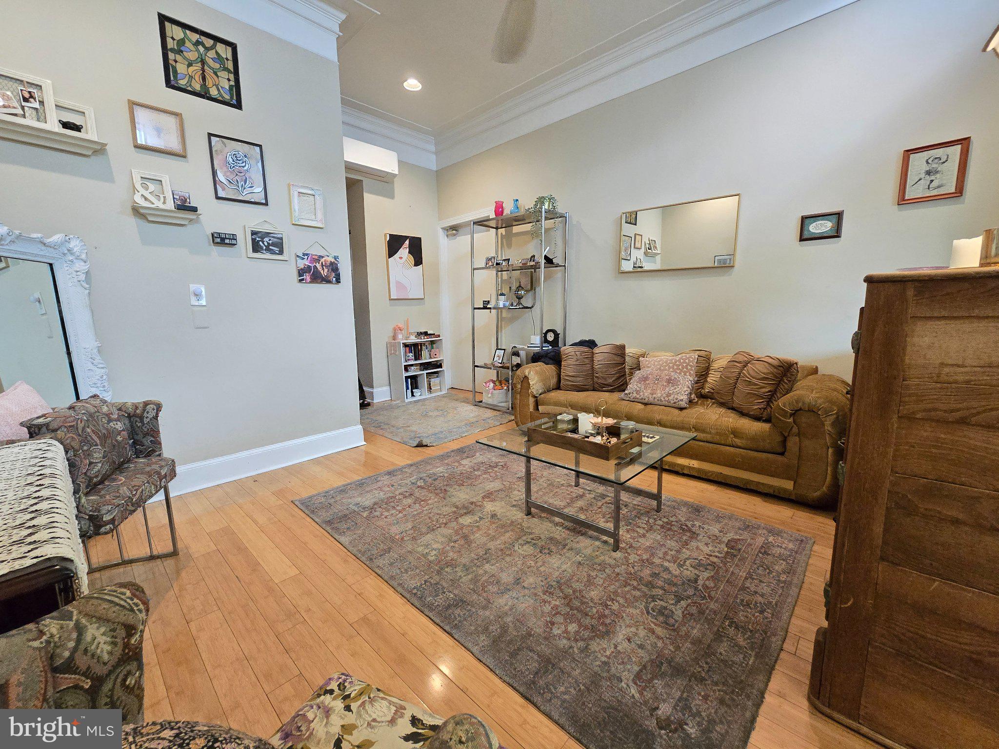1320 South Broad Street, Unit A Philadelphia, PA 19146 - Photo 12 of 19 a living room with furniture and a rug