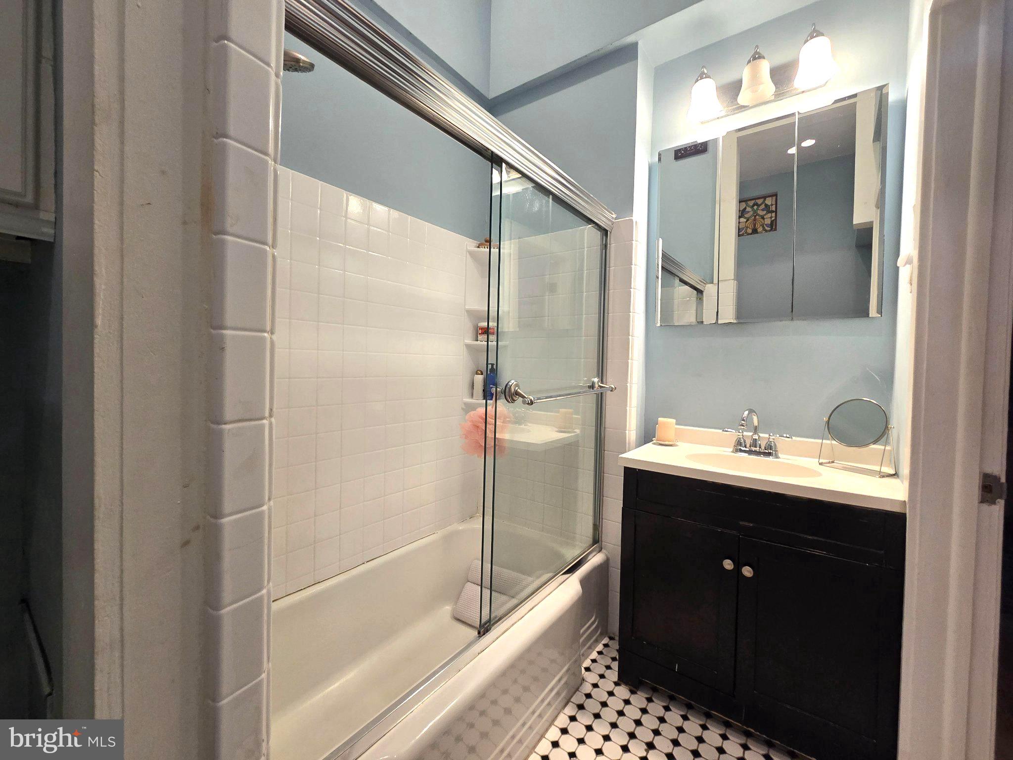1320 South Broad Street, Unit A Philadelphia, PA 19146 - Photo 17 of 19 a bathroom with a bathtub and a sink