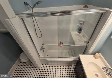 a bathroom with a sink and a shower