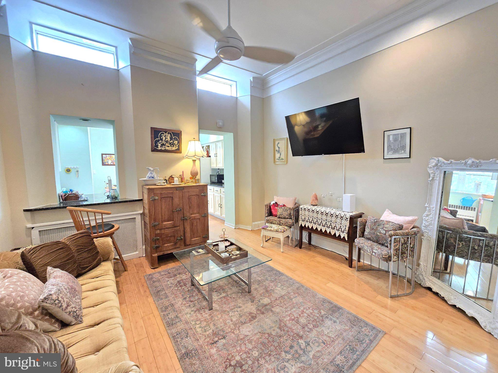 1320 South Broad Street, Unit A Philadelphia, PA 19146 - Photo 8 of 19 a living room with furniture and a flat screen tv