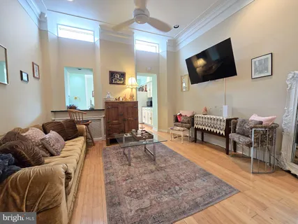 a living room with furniture and a flat screen tv