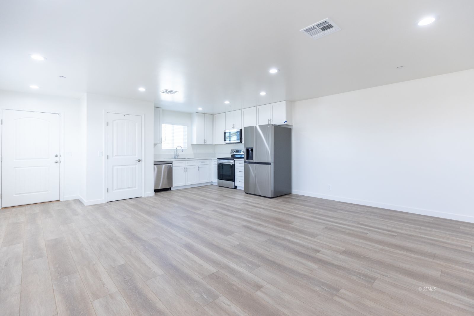 713 South Downs Street Ridgecrest, CA 93555 - Photo 5 of 38 a view of empty room with wooden floor