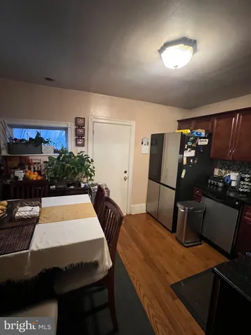 a room with a bed table and chairs