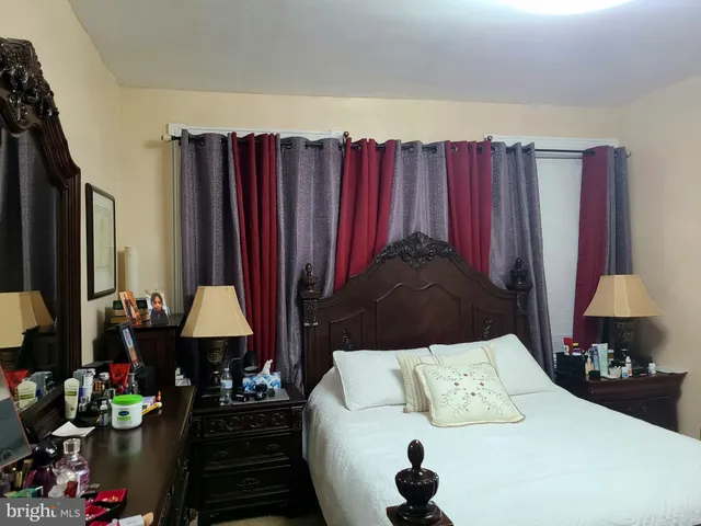 a bed room with a bed and a lamp