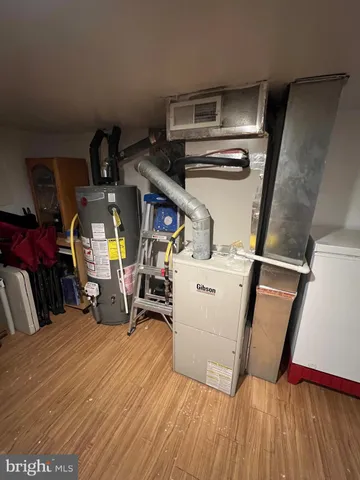 a bed room with a bed and a chair