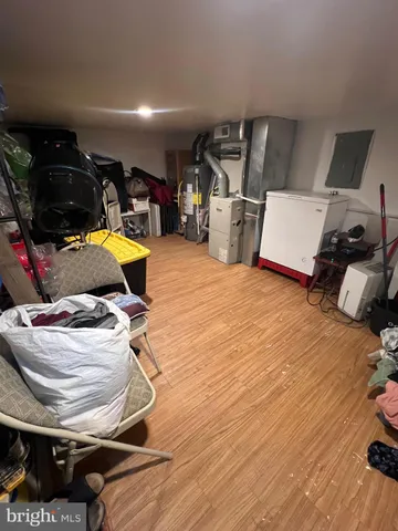 a room with wooden floor and gym equipment