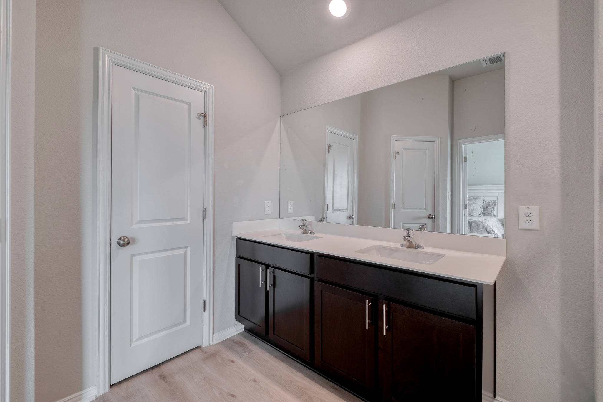 1000 Bright Star Cove Georgetown, TX 78628 - Photo 19 of 40 a bathroom with a double vanity sink and mirror