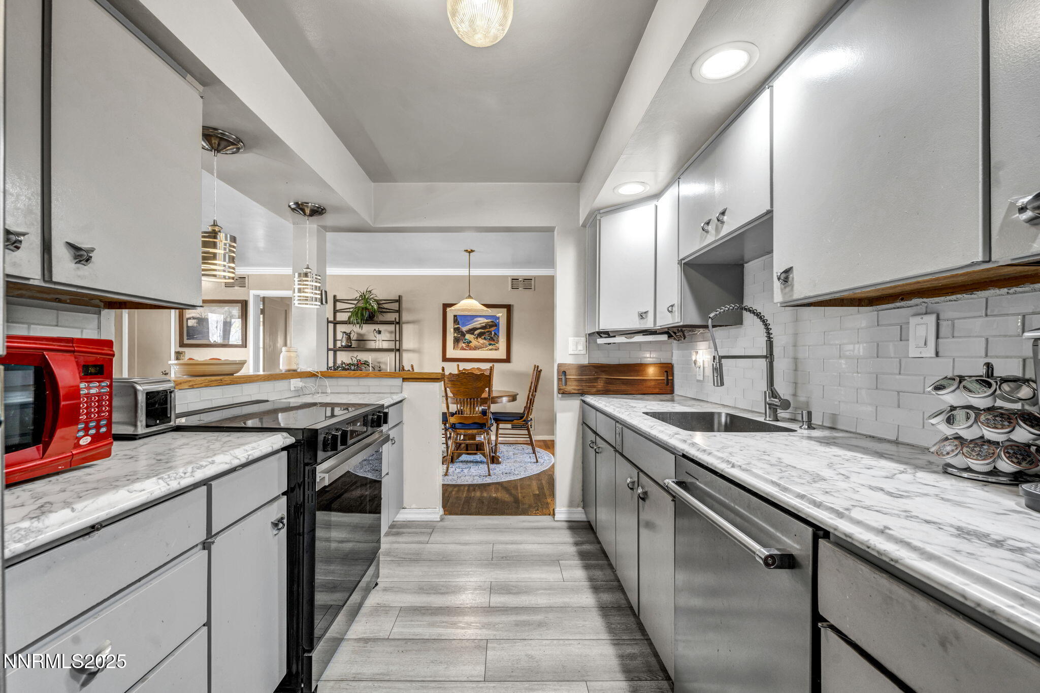 72 Suda Way Reno, NV 89509 - Photo 17 of 41 a kitchen with stainless steel appliances granite countertop a stove and a sink