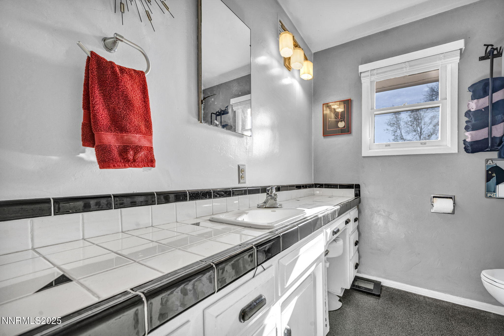 72 Suda Way Reno, NV 89509 - Photo 24 of 41 a bathroom with a granite countertop sink and a mirror