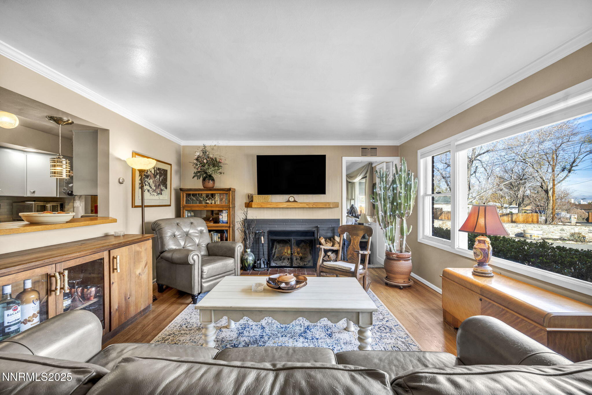 72 Suda Way Reno, NV 89509 - Photo 8 of 41 a living room with furniture a flat screen tv and a fireplace