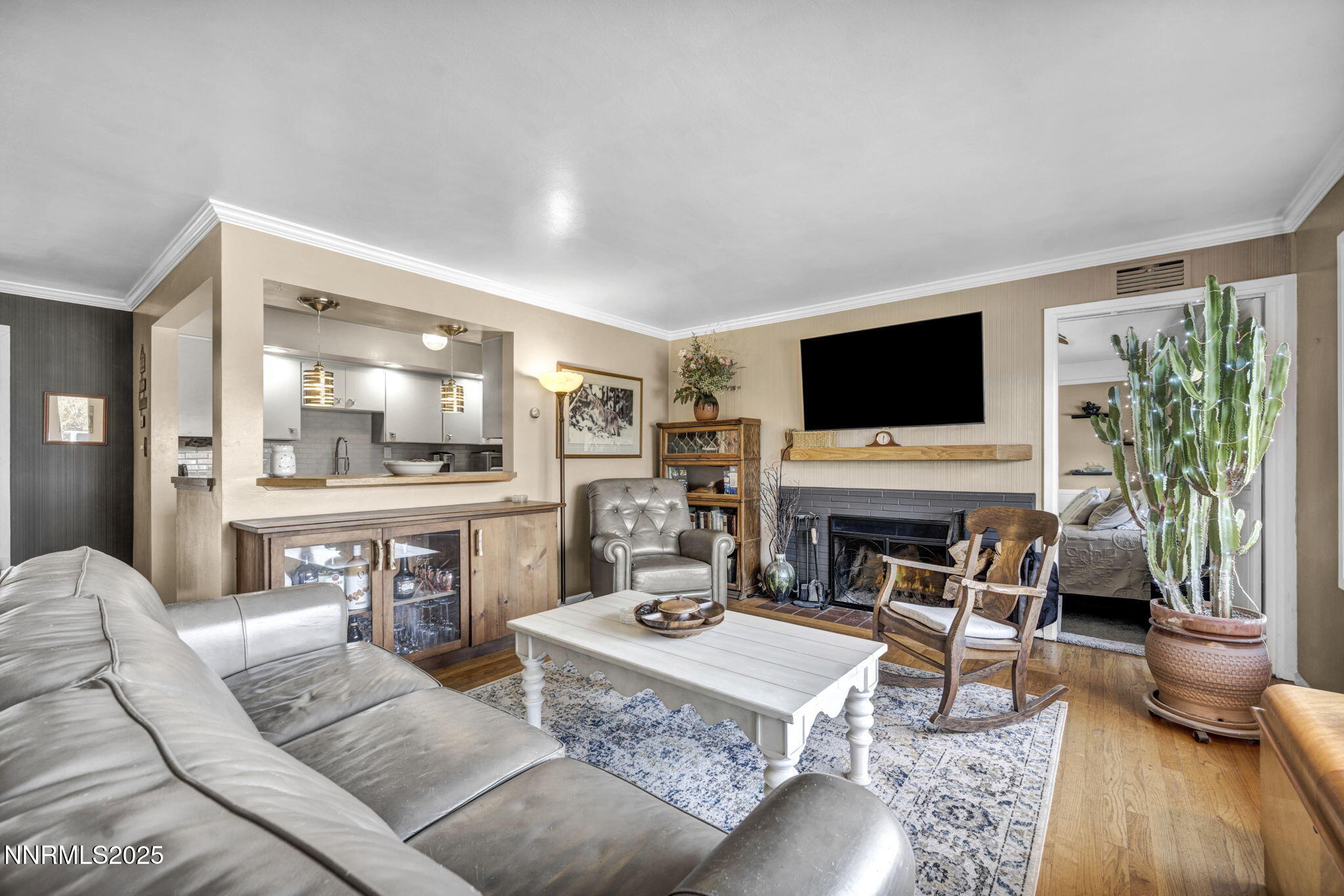72 Suda Way Reno, NV 89509 - Photo 9 of 41 a living room with furniture a flat screen tv and a fireplace