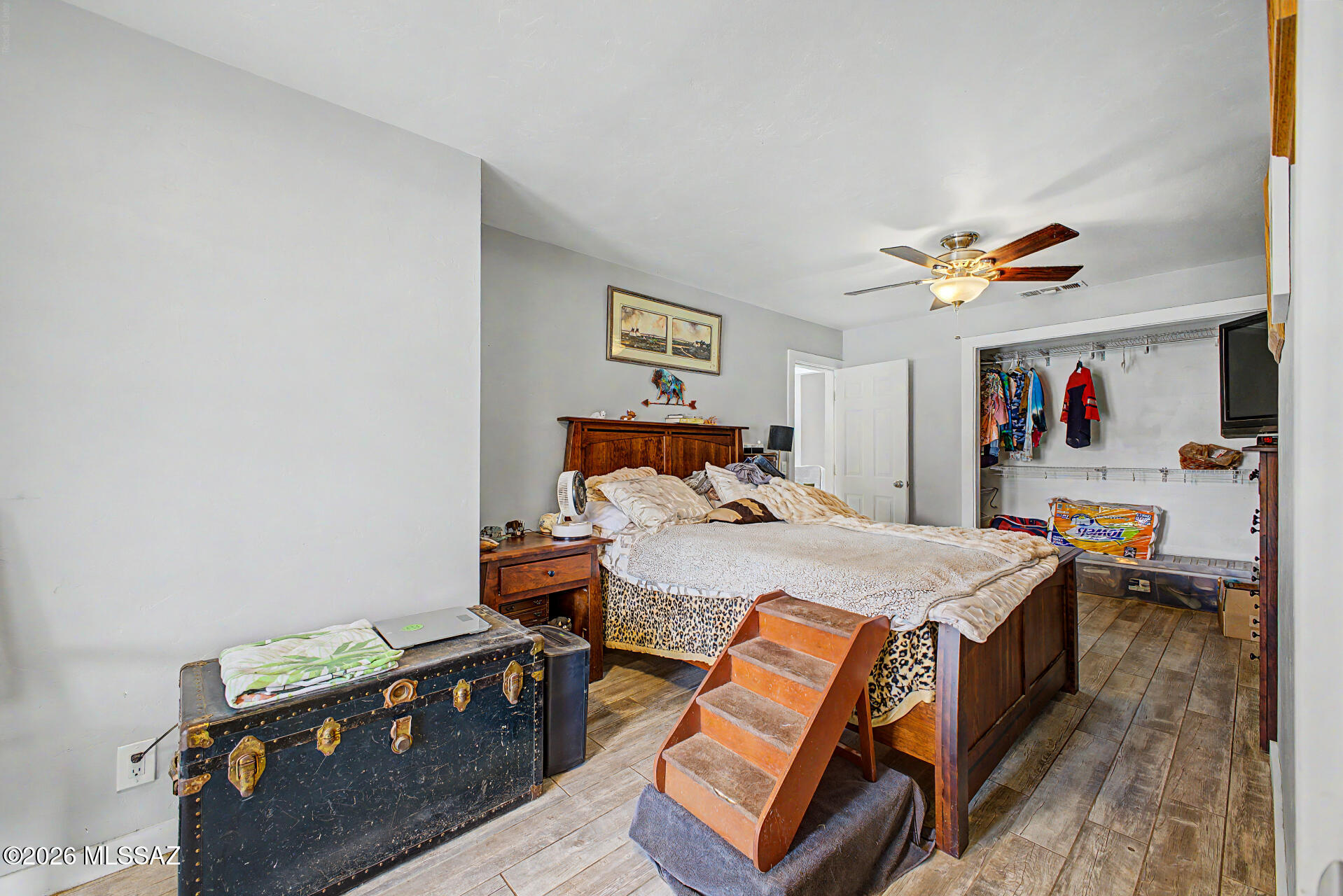 1172 East Allen Road Tucson, AZ 85719 - Photo 12 of 25 a bed room with a bed and a tv