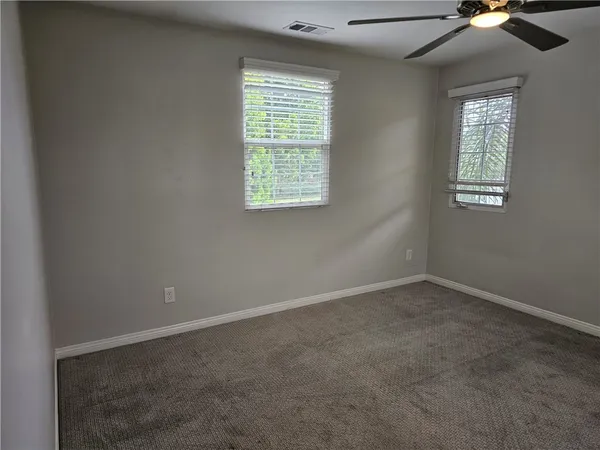 a bathroom with a shower and a sink