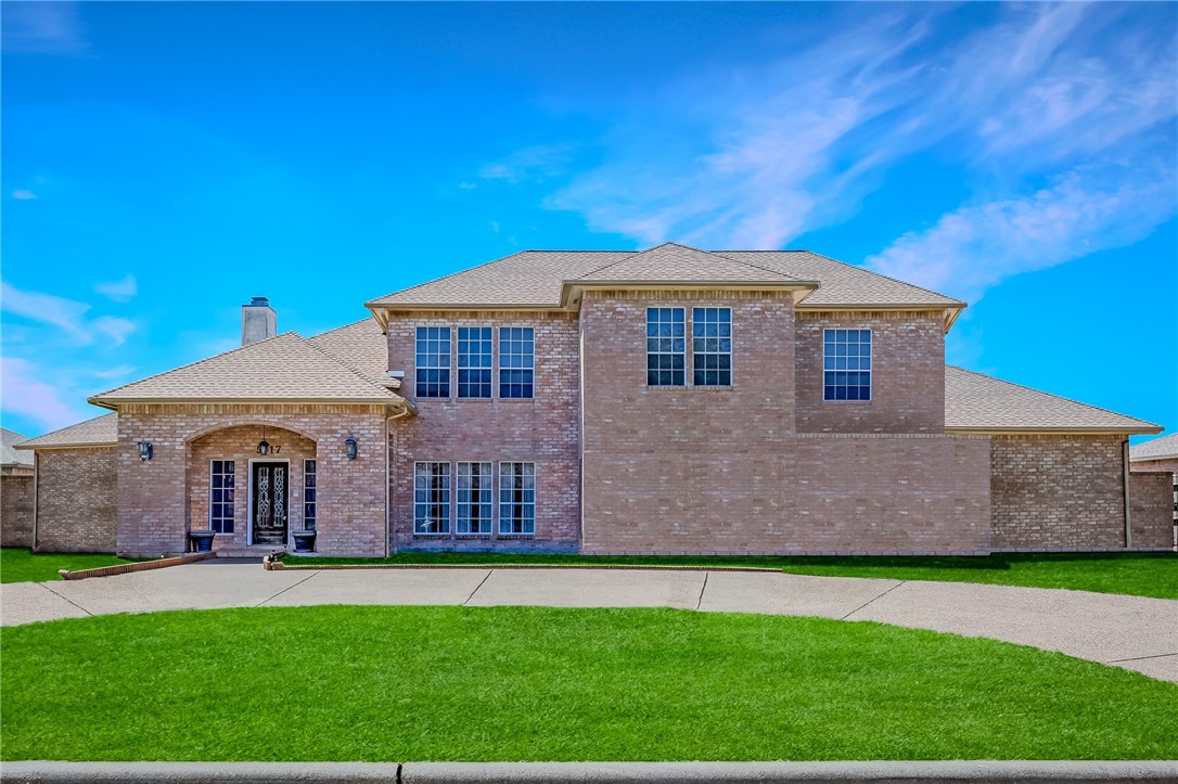 5917 Harvest Hill Road Corpus Christi, TX 78414 - Photo 1 of 40 a front view of a house with a garden