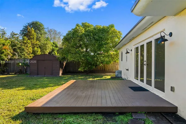 a view of yard with swimming pool and outdoor seating